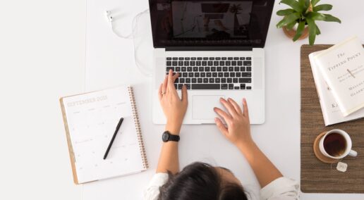 side gig, a woman browsing on her laptop