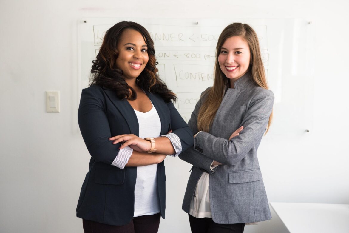 become a mentor, two women standing confidently