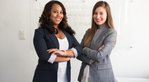 become a mentor, two women standing confidently