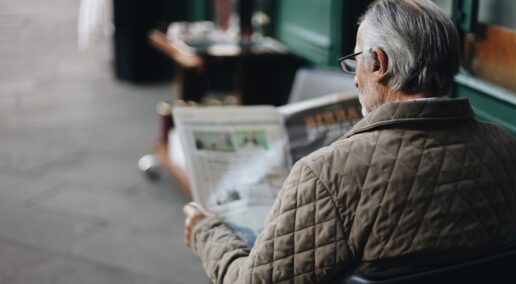 side job, an old man reading the newspaper